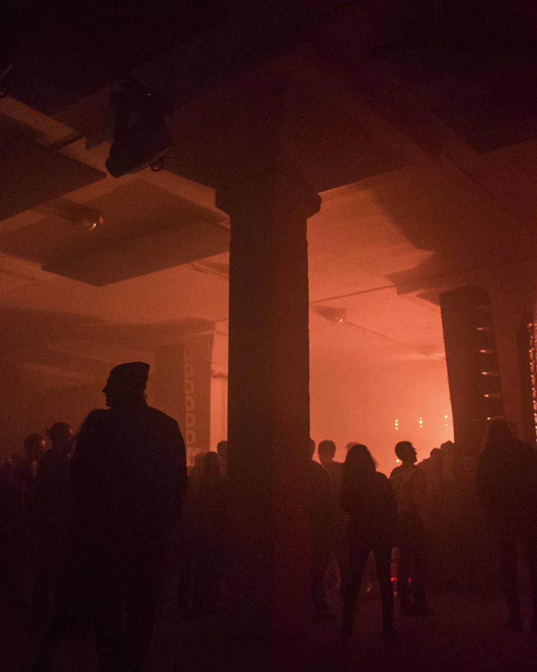 DJ decks lit purple at an underground night