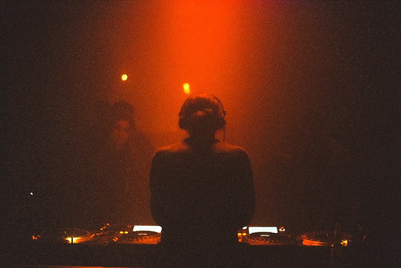 DJ silhouette behind the decks