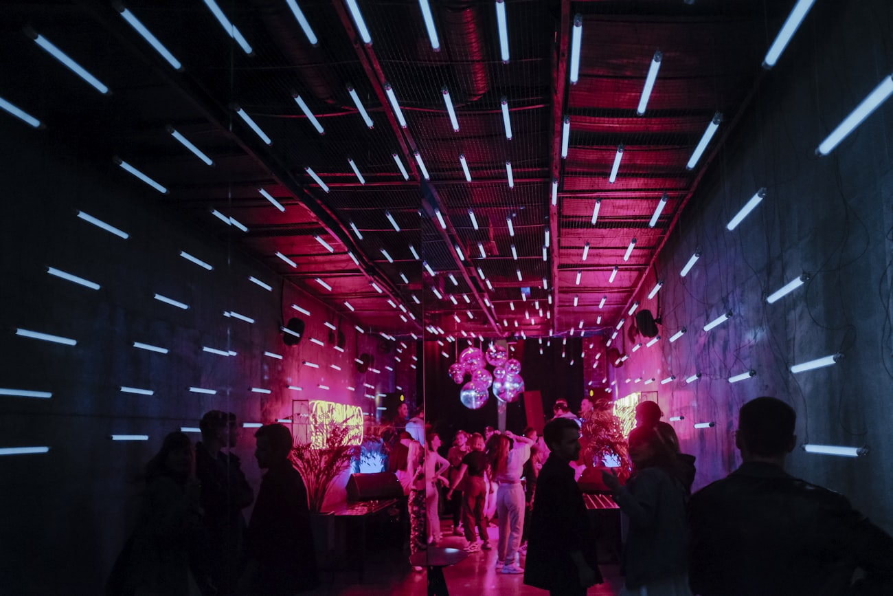 Neon-lit venue ceiling